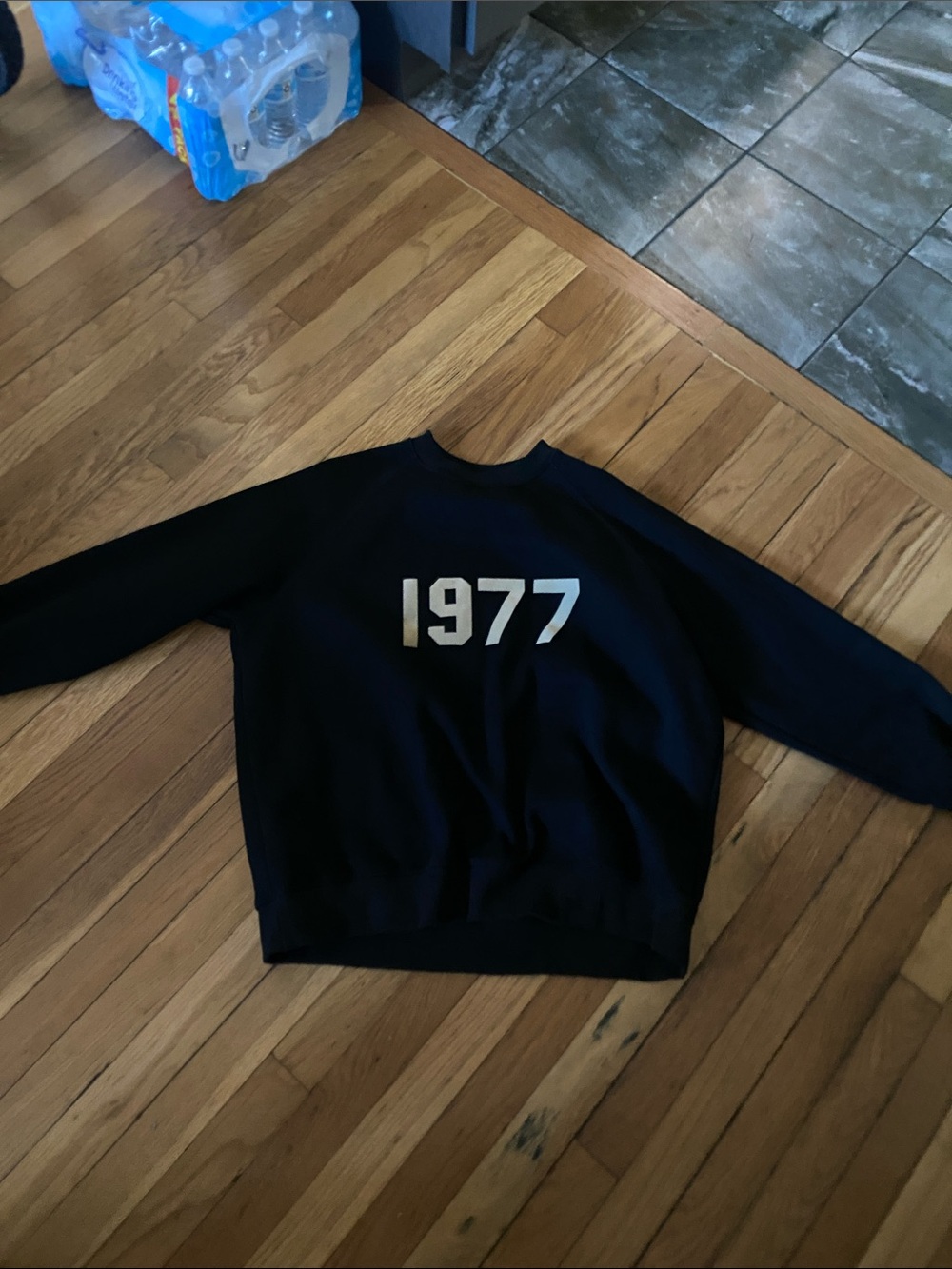 Essentials Black Crewneck Sweater with White '1977' Graphic